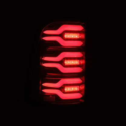 AlphaRex 19-21 Dodge Ram 1500 Luxx-Series LED Tail Lights Black/Red w/Activ Light/Seq