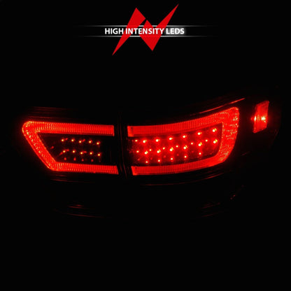 ANZO 11-13 Jeep Grand Cherokee LED Taillights w/ Lightbar Black Housing/Clear Lens 4pcs 311439